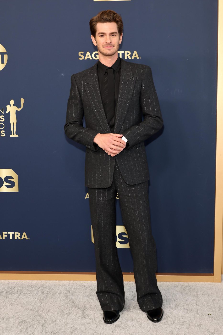 Andrew Garfield posing for photographers